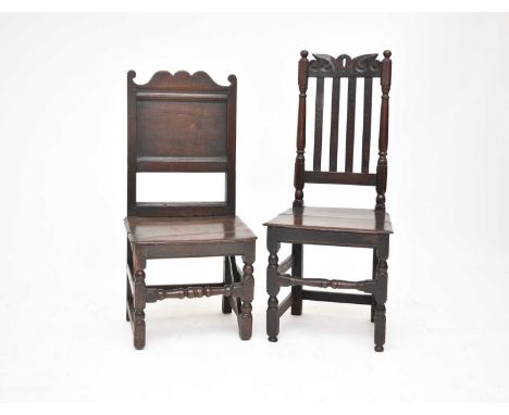 A 17th/18th century oak panel back chair, probably Lancashire, the shaped cresting over a plain panel back, stamped I.B verso