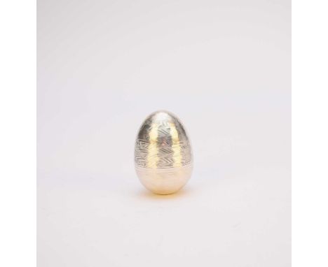 A Nicholas Plummer silver and gilt surprise egg, London 1998, the wavy engine turned egg opening to reveal a gilt rose and bu