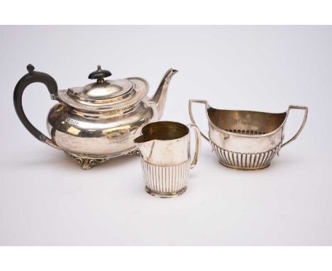 A Victorian silver teapot, Atkin Brothers, Sheffield 1858, of oval form with ebonised handle and finial, 15.5cm high, togethe