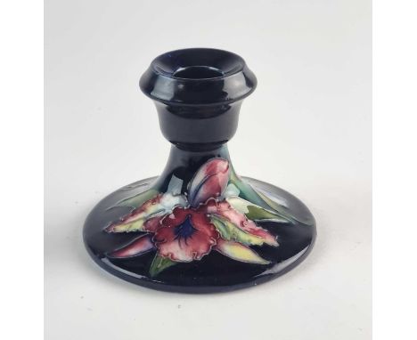 An assorted group of Moorcroft pottery, comprising a William Moorcroft 'Orchid' candlestick, circa 1928-49, impressed marks, 