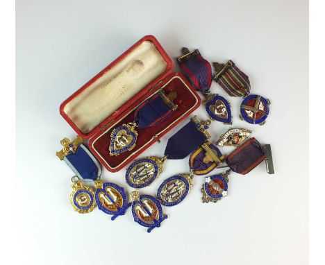 An assorted collection of silver, silver gilt and polychrome enamel Oddfellows badges (9)