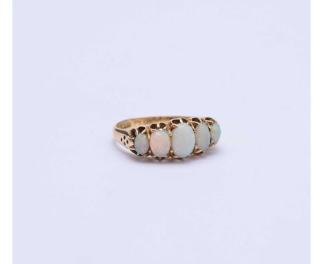 An 18ct gold graduated five stone opal ring, the oval cabochon opals claw set to yellow gold shank, ring size K 1/2, weight a