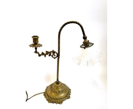 A brass lamp and candle holder with foliate design and a glass shade. 41cm x 38cm.