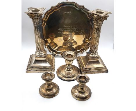 A pair of column candlesticks with sconces Elkington &amp; Co Ltd, London 1909, 20cm, a pair of short candlesticks James Deak