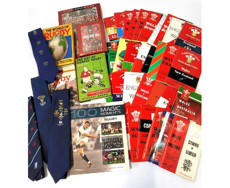 A collection of rugby memorabilia, predominantly Welsh including programmes some signed, books and ties.