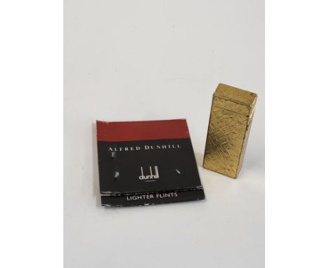 A Dunhill Rollagas Lighter Model RE24163 including Dunhill lighter flints.