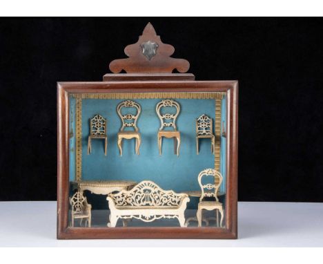 Nine pieces of 19th century fretwork dolls’ house furniture,  made from pine comprising a sofa, two tables, three larger and 