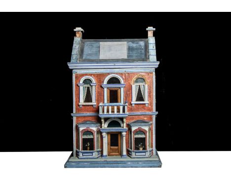 A Gottschalk wooden blue roof dolls’ house,  with brick paper facade and light blue with dark blue lining painted architectur