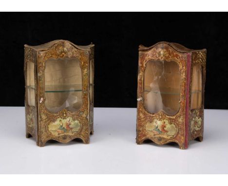 A pair of French lithographed tinplate and wooden doll’s display cabinets,  the tinplate front with scrolling foliage decorat