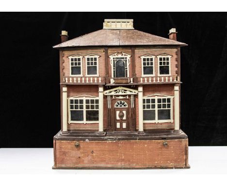 A 1930s part fretwork dolls’ house, possibly Hobbies Ltd with unusual pull-out garden,  plywood with brick and tiled paper, c