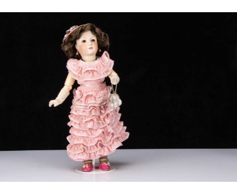 A Unis 306 Jumeau 1938 Princess doll, with brown sleeping flirty eyes, light brown brows, closed mouth the top lip painted da