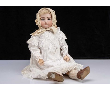 A large Simon & Halbig for Kammer & Reinhardt child doll,  with brown sleeping eyes, pierced ears, long blonde hair wig, join