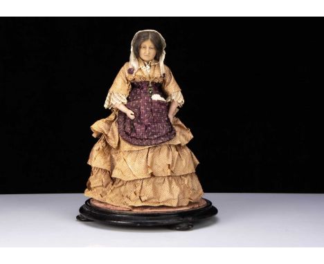 A very rare Pierotti poured wax portrait doll of Madame Tussauds, the shoulder-head with inset blue glass eyes, characterful 