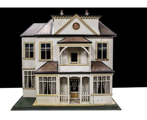 A large Christian Hacker wooden dolls’ house No. 453,  cream painted, two ground floor bay windows with central front door, p