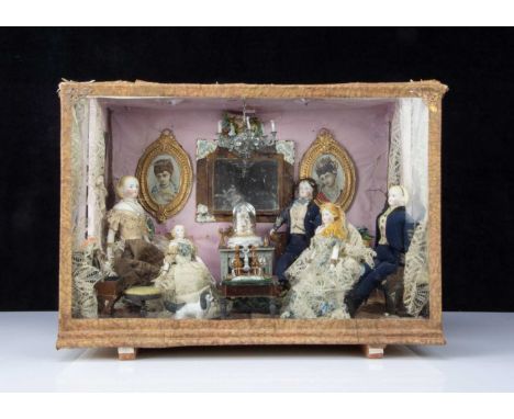 A second half of the 19th century room setting with bisque shoulder head dolls,  with five bisque shoulder-head dolls with bl