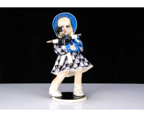 A rare Lenci porcelain figure of a 300 Series girl doll by Helen (Elena) Konig-Scavini and Entico Scavini, standing holding a