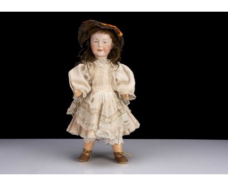 A rare Armand Marseille painted eye character girl doll circa 1910,  with blue slightly intaglio eyes, black centre and highl