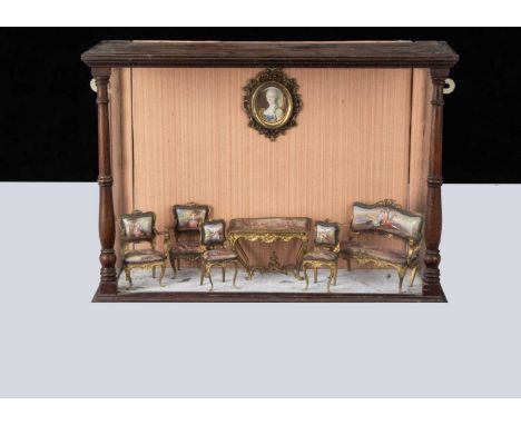 A set of early 20th century Viennese enamel and gilt metal dolls’ house furniture,  comprising sofa, two armchairs, two chair