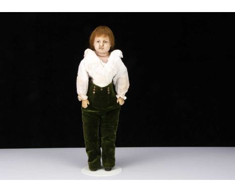 An unusual mid 19th century English poured wax boy doll,  with inserted dark glass eyes, eyelid crease, open/closed mouth wit