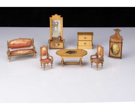 A late 19th century German satinwood dolls’ house set, comprising pier mirror with planter —6 ¼in. (16cm.) high; a corner cup