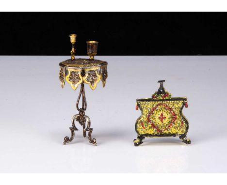 A German bronzed soft metal dolls’ house smoking table,  with gilt painted detail on tripod legs —4 ¼in. (11cm.) high (missin