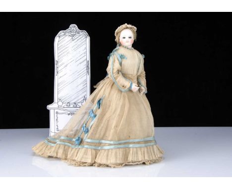 A fine and rare French bisque swivel head fashionable doll with label for the Paris shop ‘A La Petite Amazone’, the pressed b