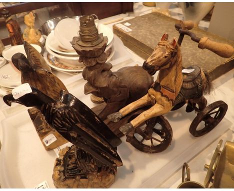 A selection of carved animal figurines to include two birds of prey, elephant lamp etc. Not available for in-house P&amp;P, c