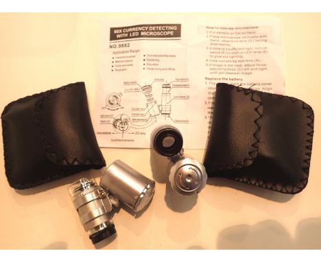Two cased jewellery/currency loupes with LED light. P&amp;P Group 1 (£14+VAT for the first lot and £1+VAT for subsequent lots