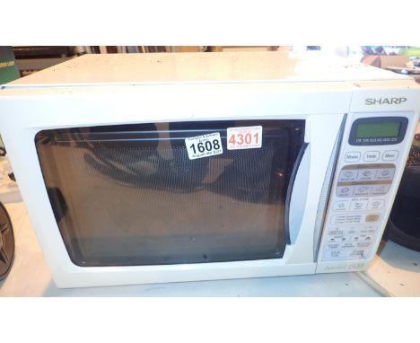 Sharp microwave dual grill cooker. Not available for in-house P&P, contact Paul O'Hea at Mailboxes on 01925 659133Condition R