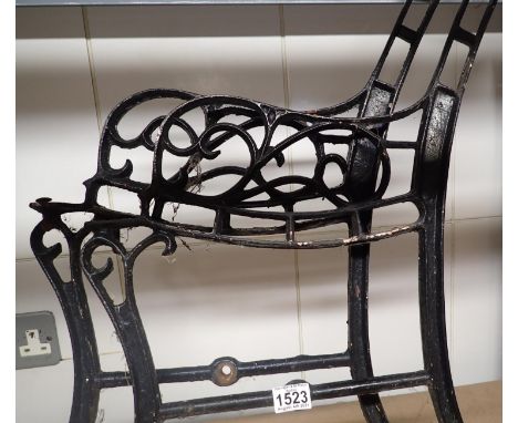 Pair of vintage cast iron bench ends and bracing bar. Not available for in-house P&amp;P, contact Paul O'Hea at Mailboxes on 