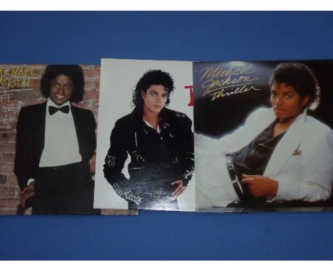 Three Michael Jackson records, 'Off the Wall', 'Bad' & 'Thriller' 
