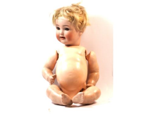 A German bisque headed doll
With blonde wig, open/shut brown eyes, open mouth, impressed mark 'K*R 22 Germany 0' with composi