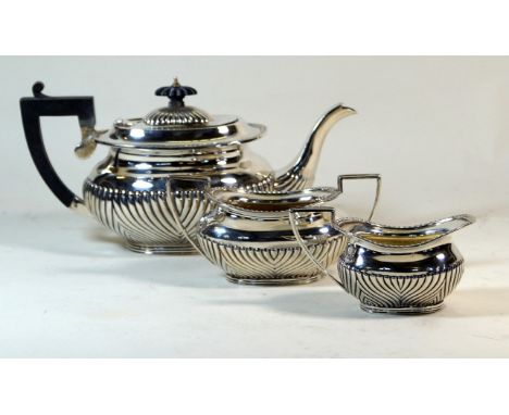 A Victorian hallmarked silver three piece tea service
Comprising teapot, twin handled sugar bowl, milk jug, each having gadro