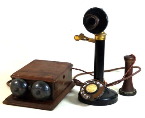 An early 20th century candlestick telephone
Height 32cm, together with one switching box, three bell boxes (one reconditioned