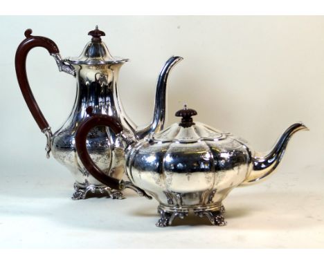 A matched two piece tea service
Comprising hot water pot, teapot, each having chased floral decoration, made by Charles Green