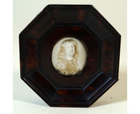 An antique miniature portrait inset within tortoiseshell veneered frame
The central hand-painted enamel panel depicting a 17t