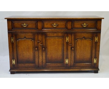 A Titchmarsh & Goodwin (Ipswich) 17th/18th Century style solid oak dresser base, 20th Century
Three frieze drawers with brass