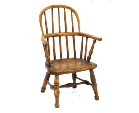 An 19th Century elm and beech child's Windsor chair
The comb back above dished seat and four turned supports united by turned