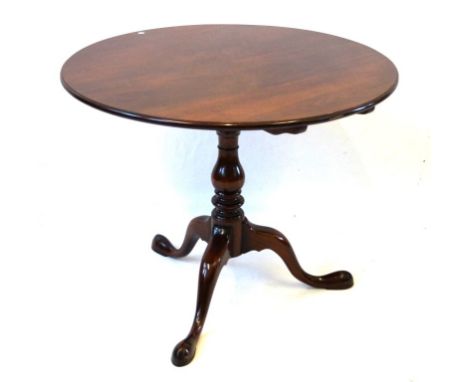 A George III style mahogany 'bird-cage' tilt top tripod table, 20th Century
The circular top raised on baluster and ring turn