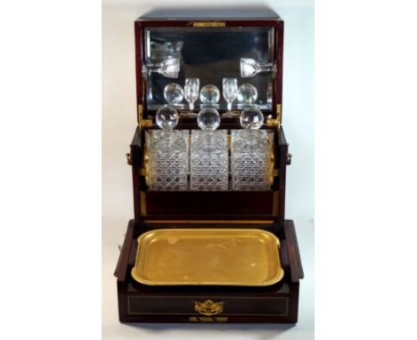 An Edwardian inlaid mahogany cased gentleman's decanter & games box
The hinged cover lifts to enclose a mirror, three decante