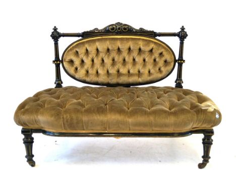 A Victorian parcel-gilt ebonised sofa
The raised rear structure in the Aesthetic taste, with buttoned green draylon back and 