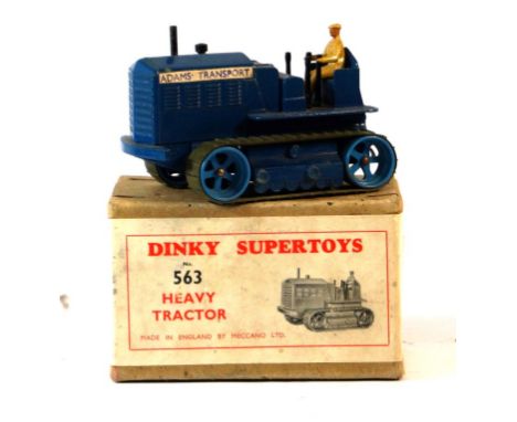 A boxed Dinky no. 563 Heavy Tractor - rare issue
Finished in blue body, mid blue metal rollers with dark green rubber tracks,