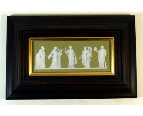 A 19th Century Wedgwood green Jasperware plaque 
Of rectangular form, decorated with Grecian figures playing musical instrume
