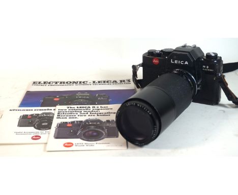 A Leica R3 electronic camera in black finish
With Leitz Wetzlar f 200mm lens, serial number 1478664, complete with instructio