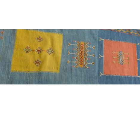 Caucasian runner, 20th Century
A mainly blue ground, the central panel with individual terracotta and yellow panels, with zig