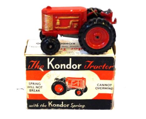 A boxed 'The Kondor' tractor 
In red, no. 8194/48 - clockwork with key.