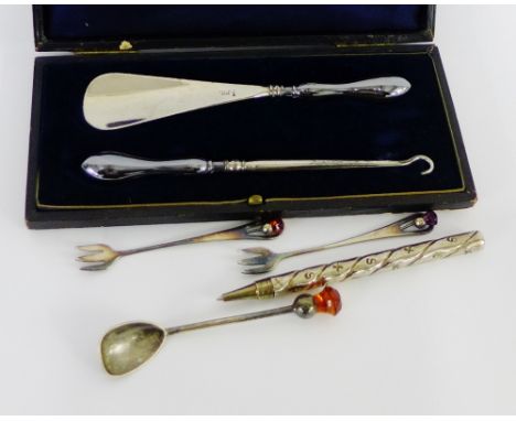 A mixed lot to include an Edwardian silver handled button hook and shoe horn set, two Epns pickle forks and spoon and a white