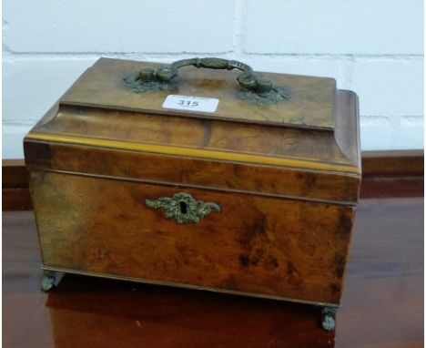 A 19th century burr wood tea caddy the sarcophagus lid with brass handle escutcheon and four paw feet, 24 x 17cm 