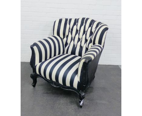 A contemporary black and white striped upholstered button back armchair, 90 x 78cm