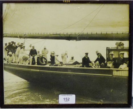 George V on board RYS Britannia, black and white photographic print in a glazed frame, dated 1926 and retailed by Walter Jone
